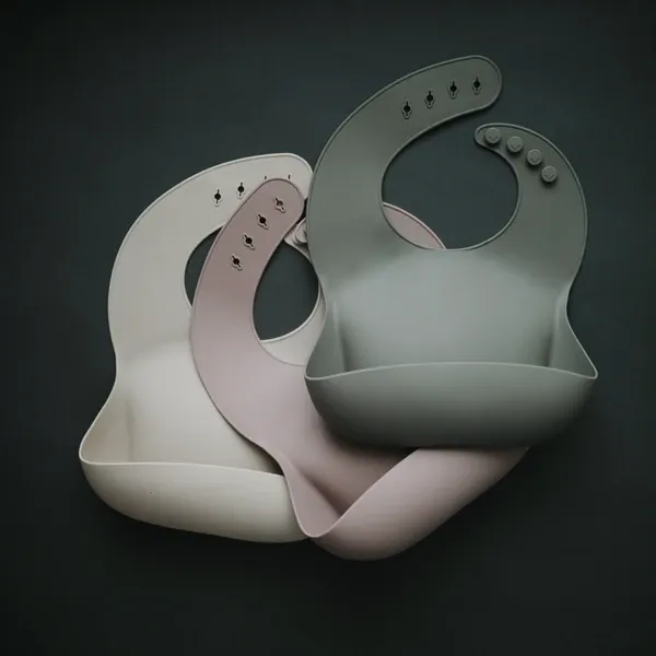 Mushie Silicone Baby Bib | Shifting Sand