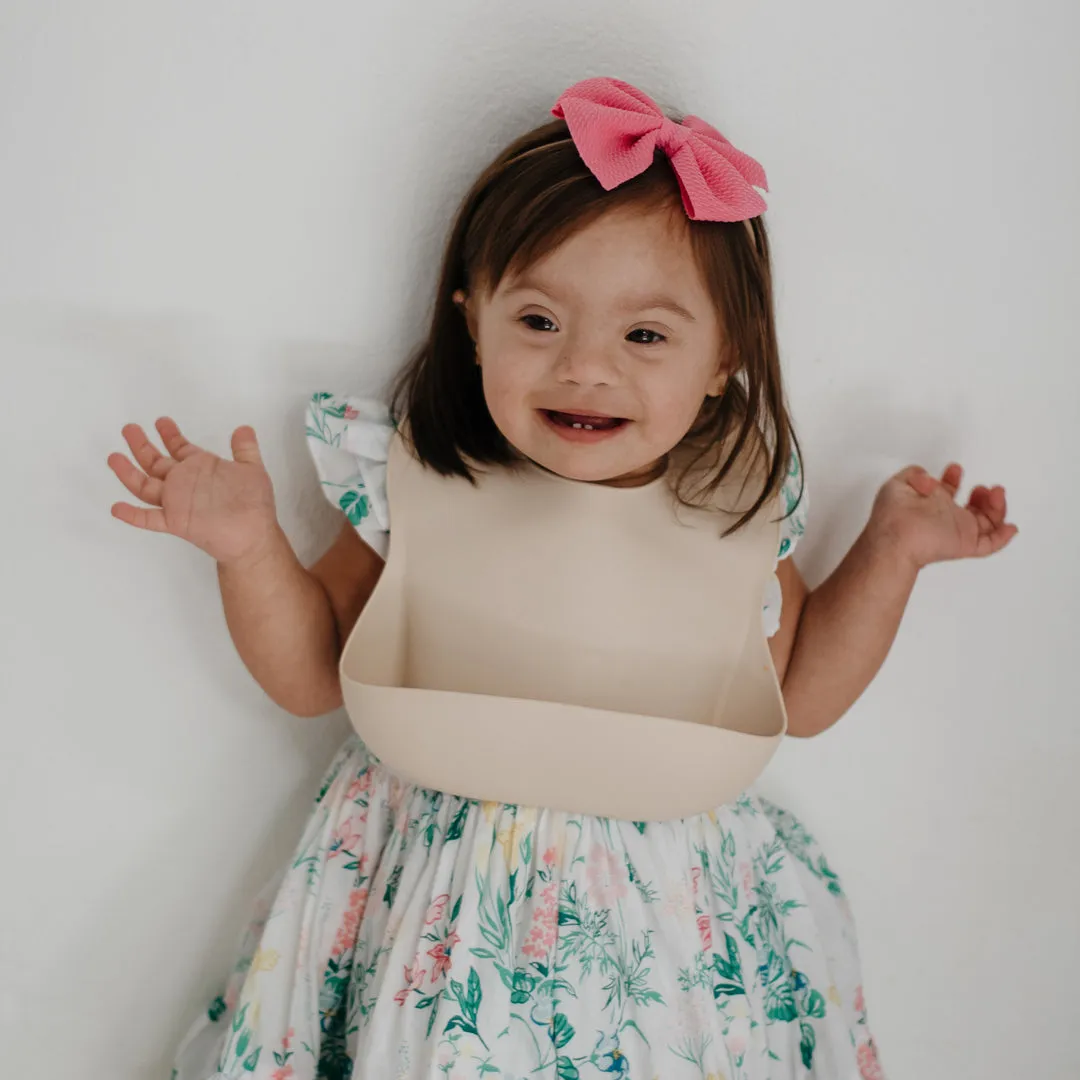 Mushie Silicone Baby Bib | Shifting Sand
